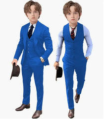 A young boy models a royal blue three-piece suit set consisting of a blazer, vest, and trousers.