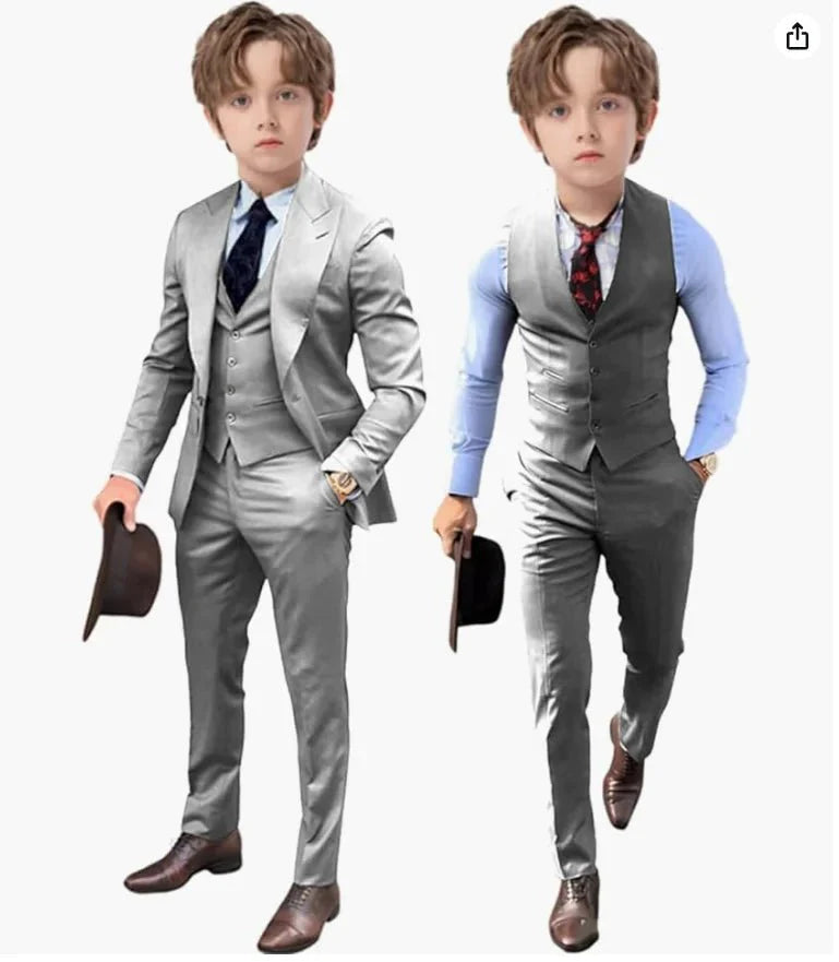 Two boys wearing grey three-piece suits with dress shirts and ties, holding hats.
