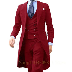 A man wears a three-piece red suit featuring a long tail coat, a double-breasted waistcoat, and trousers.