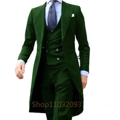 A man wears a dark green three-piece suit featuring a long tail coat, waistcoat, and trousers.