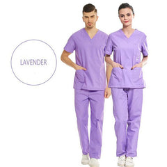 A man and a woman wearing matching lavender V-neck medical scrub sets.