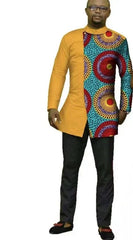 A man wears a long-sleeved mustard yellow shirt with a patterned panel featuring colorful circles.