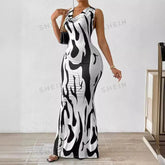 A woman wears a sleeveless, floor-length bodycon maxi dress with a black and white abstract print.