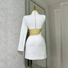 A white mini dress with a high neck, one long sleeve, and a cutout back with pearl detailing.