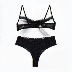A black lace lingerie set featuring a cutout bralette with a tulle bow and matching thong.