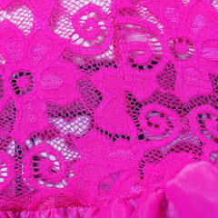 A close-up view of a vibrant pink lace fabric with a floral pattern and a ruffled hem.