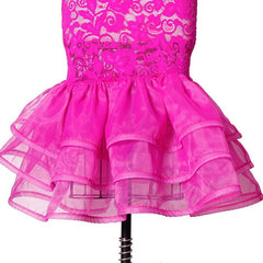 A bright pink lace dress featuring a fitted bodice and a layered ruffled organza skirt.