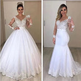 A woman models a two-piece wedding dress with a detachable ballgown skirt and mermaid silhouette.