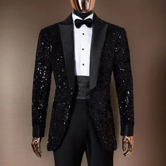 A black sequined tuxedo blazer with a notched lapel and matching trousers on a mannequin.