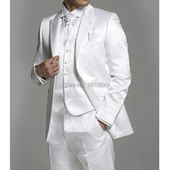A man wearing a shiny white three-piece suit consisting of a blazer, vest, and trousers.