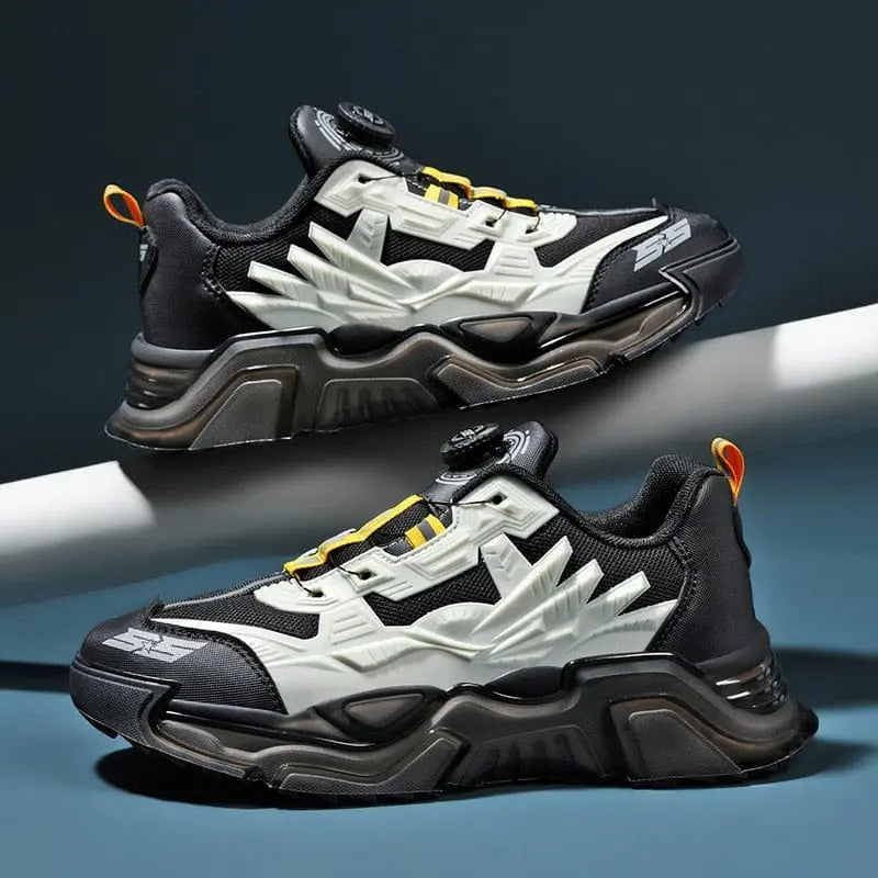 A pair of men's luxury lace-free sneakers featuring bold white and yellow accents with rugged soles and thick, angular designs from the fashion loafers running shoes collection, displayed against a dark background.