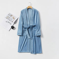 A long-sleeved blue velour fleece men's robe with a tie belt and white piping detail.