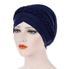 A navy blue cotton turban cap featuring a decorative braided headband detail.