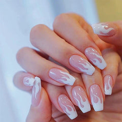 Mid-length coffin-shaped press-on nails featuring a white flame design on a clear base.