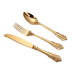 A three-piece set of gold-colored stainless steel western tableware featuring ornate relief handles.