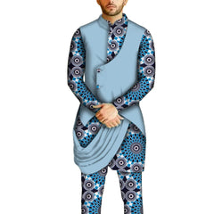 A man wears a light blue vest over a long-sleeved shirt and pants featuring a blue geometric print.