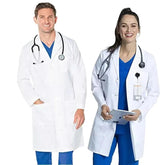 A man and a woman wearing white lab coats over blue medical scrubs with stethoscopes.