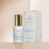A bottle of Pinky Leem banana scented eyelash glue next to its matching product box.