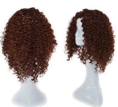 A short, curly, auburn-brown wig displayed on two white mannequin heads.