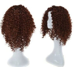 A short, curly, auburn-brown wig displayed on two white mannequin heads.
