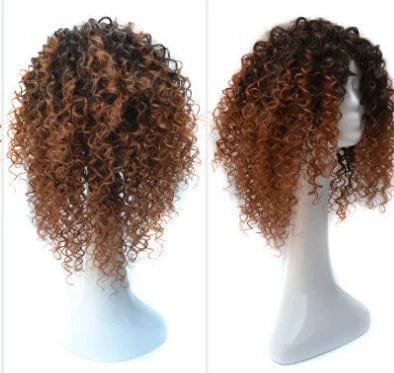 A short, curly, ombre-colored wig with dark roots and brown ends on a mannequin head.