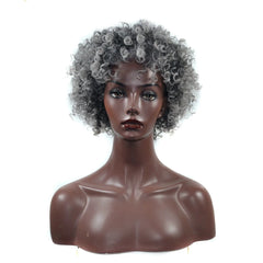 A mannequin head displays a short, curly, grey-toned afro wig with a voluminous, textured style.