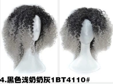 A mannequin head displays a short, curly black and grey ombre wig with voluminous texture.