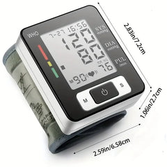 A digital wrist blood pressure monitor with an LCD screen showing measurements and dimensions.
