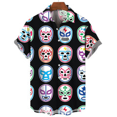 A black short-sleeved button-down shirt featuring a repeating pattern of colorful lucha libre masks.