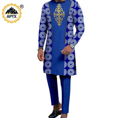 A man wears a blue long-sleeved tunic with a gold chest pattern and matching blue trousers.