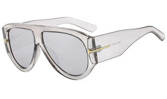 Oversized pilot sunglasses with a translucent grey frame and gradient lenses.