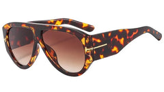 Oversized pilot sunglasses with a thick tortoiseshell frame and gradient lenses.