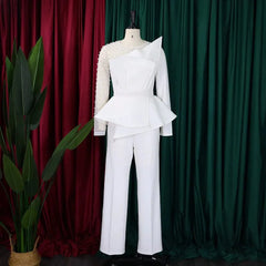 A white jumpsuit with a beaded transparent sleeve, asymmetrical peplum waist, and straight legs.