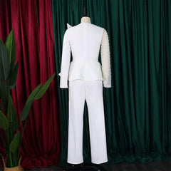 A white long-sleeved jumpsuit with a beaded transparent sleeve and a peplum waist.