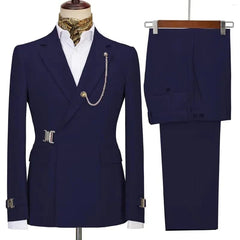 A navy blue slim-fit two-piece men's suit featuring a blazer with a decorative chain and buckle.