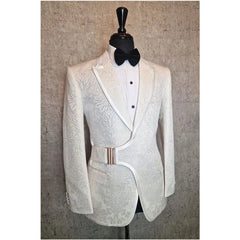 A white patterned tuxedo blazer with a side buckle closure, worn with a white shirt and bow tie.