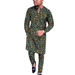 A man wears a long-sleeved V-neck shirt and matching trousers featuring a colorful African paisley print.