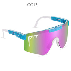 Pit Viper sunglasses featuring a blue speckled frame and a reflective pink and green lens.