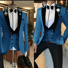 A blue three-piece slim fit tuxedo with a black peak lapel, vest, and bow tie.