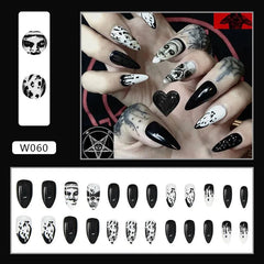 A set of twenty-four almond-shaped press-on nails featuring black and white gothic designs.