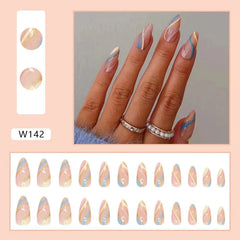 A set of twenty-four almond-shaped press-on nails featuring a wavy blue, pink, and gold design.