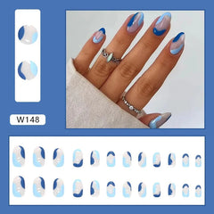 A set of almond-shaped press-on nails featuring a wavy blue and light blue abstract design.