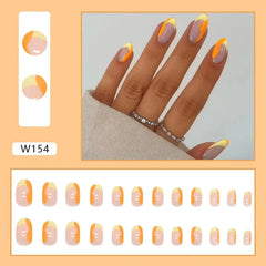 A set of twenty-four almond-shaped press-on nails featuring a purple base with yellow and orange tips.