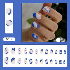 A set of twenty-four almond-shaped press-on nails featuring a blue and white wavy abstract design.