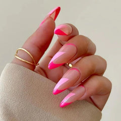 Long almond-shaped press-on nails featuring a pink and light pink diagonal French tip design.
