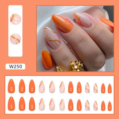 A set of twenty-four almond-shaped press-on nails featuring a mix of solid orange and wavy designs.
