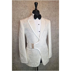 A white patterned tuxedo blazer with a side buckle closure, worn with a white shirt and bow tie.