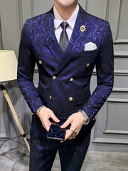 A man wears a slim-fit, double-breasted navy blue suit with a subtle abstract pattern.