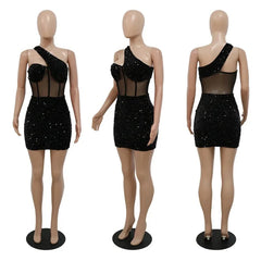 A black one-shoulder mini dress featuring sequin embellishments and a sheer mesh midsection.