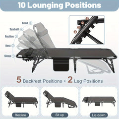 A black folding outdoor cot with an adjustable backrest and leg section for multiple positions.